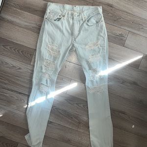 Levi’s 511 distressed jeans in excellent used condition. Just a few holes 😂